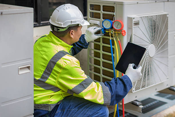 Professional Air Conditioning Repair technician working in Sheldonville, MA